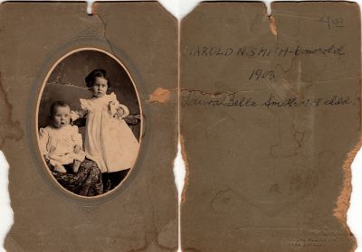 Harold N. Smith & Laura Belle Smith

This was Donated by Sue Pool

This damaged photo mounted on board states: "Harold N. Smith-6 months old, 1903 & Laura Belle Smith, 1st child"

The Photographer was in Boston, Massachusetts.

