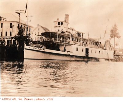 The Idaho

This Photo States: "The Idaho"
St. Maries, Idaho, 1910.
This is the Idaho at St. Maries in 1910. From Steamboats in the Timber (pp. 184-185) :

"Fire, too, claimed the big side-wheeler Idaho. This boat had been retired from active use and taken to Blackrock, a bay on the lake where a big apple orchard was located. The hull was used as a sorting and storage shed during apple harvest. In 1915, with a cargo of apples aboard, it burned to the water line and sank in the bay"

Photo Won in Auction thru Goodwill
