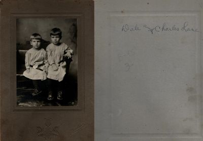 Dale Burnett Lane & Charles A. Lane

THIS HAS BEEN RETURNED TO FAMILY

This photo mounted on board states: "Dale & Charles Lane"

"The Photographers name is "Peake", Saranac, Michigan.

