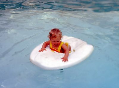 Kim

THIS HAS BEEN RETURNED TO FAMILY

This 35MM Slide States: "Kim in pool, June 1979."
